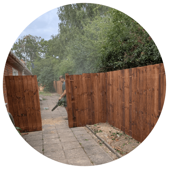 High-pressure washing removing grime from a residential patio and driveway.